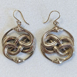 Knotted snake earrings in brass