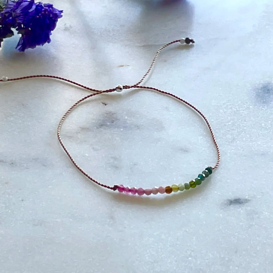 Gemstones on adjustable cord bracelets, assorted stones