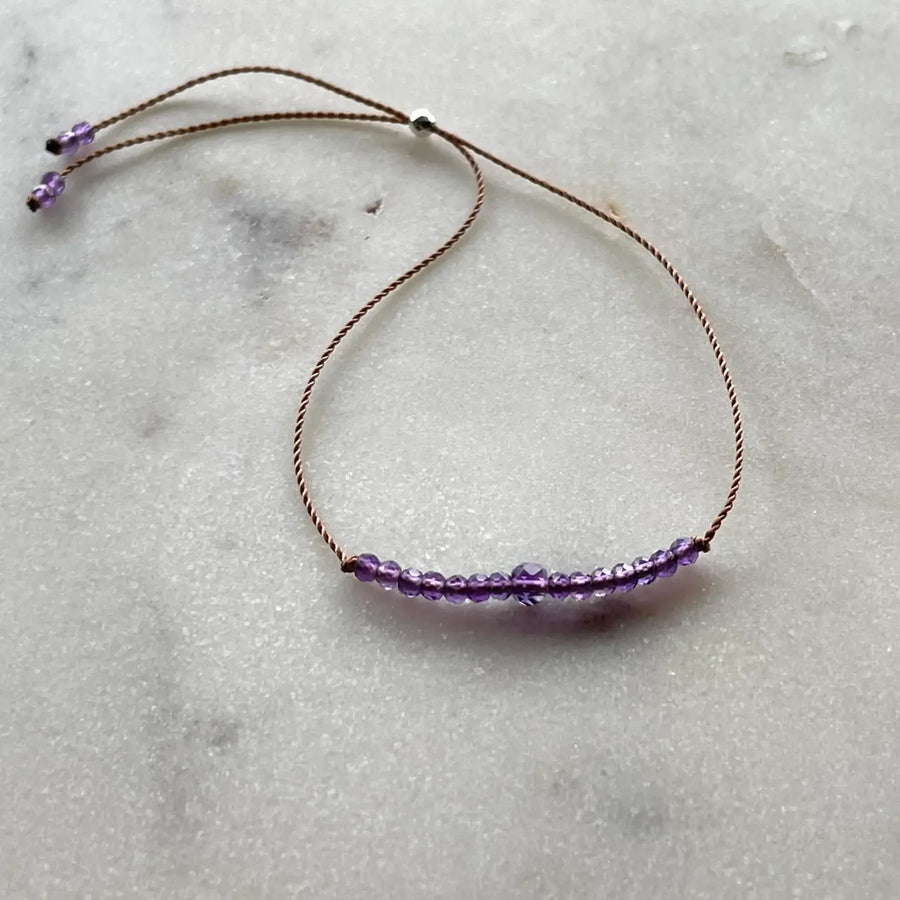 Gemstones on adjustable cord bracelets, assorted stones