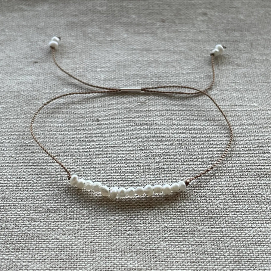 Gemstones on adjustable cord bracelets, assorted stones