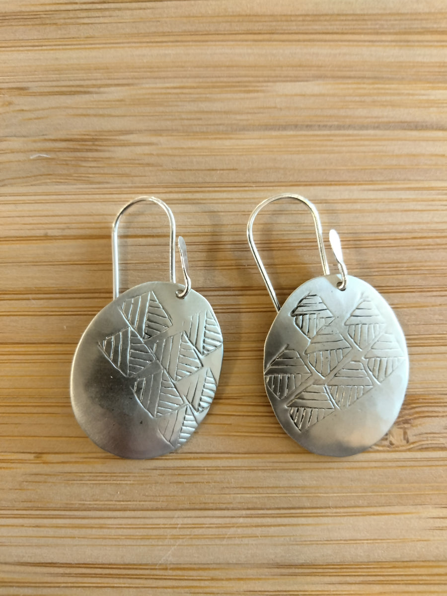 Hammered and stamped silver oval dangle earrings