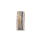 Spinner ring, wide sterling band, patinaed, with 4  narrow spinners in mixed metal